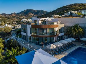 an aerial view of a building with a swimming pool at Bombien Luxury in Bodrum City