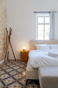 Postel nebo postele na pokoji v ubytování Mila - Boutique Hotel