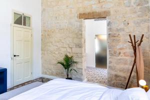 Postel nebo postele na pokoji v ubytování Mila - Boutique Hotel