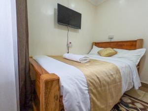 Mayas Suites客房内的一张或多张床位