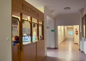 a store hallway with a restaurant sign on the wall at Dom Pracy Twórczej Politechniki Morskiej w Szczecinie in Świnoujście
