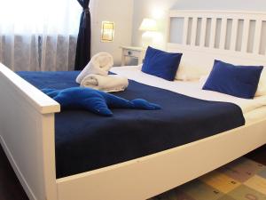 מיטה או מיטות בחדר ב-Chmielna Guest House