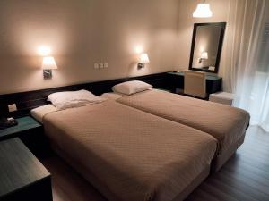 Postel nebo postele na pokoji v ubytování Plaza Hotel