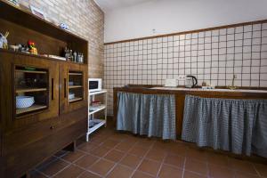 a kitchen with a counter and a sink in it at Casa Rural La Escalerilla in Teror
