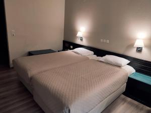 Postel nebo postele na pokoji v ubytování Plaza Hotel