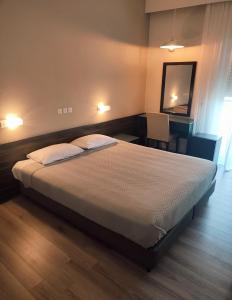 Postel nebo postele na pokoji v ubytování Plaza Hotel