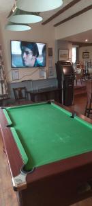 a room with a pool table and a tv at Arncliffe Arms in Glaisdale