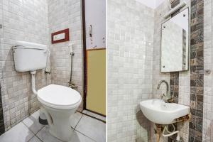 a bathroom with a toilet and a sink at FabHotel Sarwan in Agra