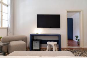 TV a/nebo společenská místnost v ubytování Mila - Boutique Hotel