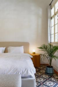 Postel nebo postele na pokoji v ubytování Mila - Boutique Hotel