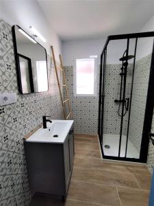 a bathroom with a sink and a shower at Son de Mar by Concept in Denia