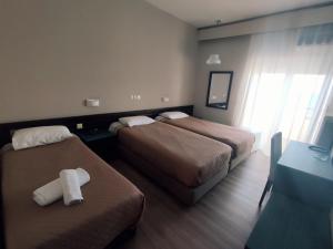 Postel nebo postele na pokoji v ubytování Plaza Hotel
