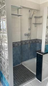 a bathroom with a shower and a bath tub at Boutique Casa Lapicida in Calpe