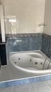 a white bath tub sitting in a bathroom at Boutique Casa Lapicida in Calpe