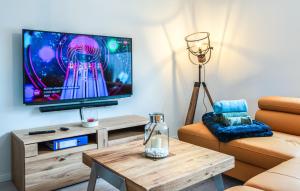 a living room with a television and a coffee table at 4 Bedroom Stunning Home In Jesendorf in Jesendorf