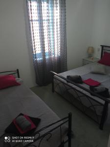 Ένα ή περισσότερα κρεβάτια σε δωμάτιο στο Welcome to Giouli's home !