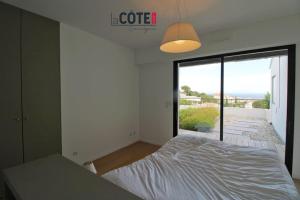 Postel nebo postele na pokoji v ubytování Villa Horizon Bleu