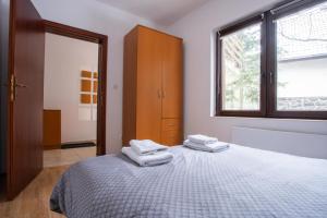 Una cama o camas en una habitación de Šumska kuća Divčibare