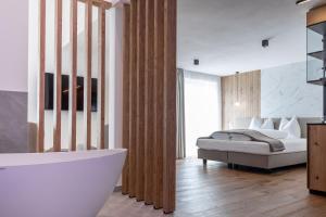 Ένα ή περισσότερα κρεβάτια σε δωμάτιο στο Hotel Alpenrose +43 φωτογραφίες