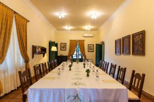a long table with chairs in a room at Patios de Cafayate - Wine Hotel & Restaurant in Cafayate
