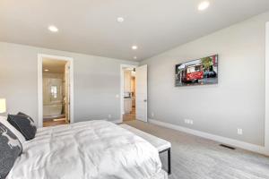 a bedroom with a bed and a tv on the wall at Mayflower Lakeside 1032 by Moose Management in Cranmer
