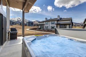 a hot tub on the patio of a house at Mayflower Lakeside 1032 by Moose Management in Cranmer