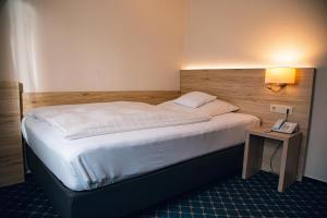 Postel nebo postele na pokoji v ubytování Hotel Panorama