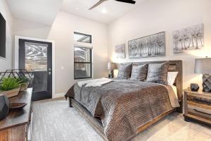 a bedroom with a large bed and a window at Mayflower Lakeside 303-14 by Moose Management in Cranmer