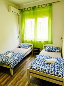 Ένα ή περισσότερα κρεβάτια σε δωμάτιο στο Croparadise Hostel