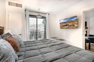 a bedroom with a large bed and a window at Stillwater 3011-13 by Moose Management in Heber City