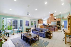 a living room with a couch and a table at Gorgeous 5 Bedroom Home with Heated Pool and Spa in Sanibel