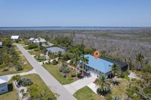 an aerial view of a resort with palm trees at Gorgeous 5 Bedroom Home with Heated Pool and Spa in Sanibel