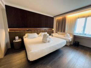 Postel nebo postele na pokoji v ubytování Hotel Bécquer