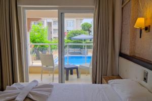Postel nebo postele na pokoji v ubytování Moni Hotel