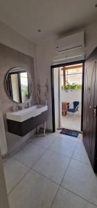 a bathroom with a sink and a mirror at Dimora diaz 23a in Siracusa +52 photos