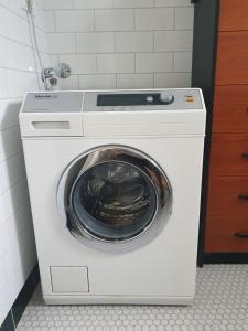 a dryer with a washing machine in a bathroom at Apartment in Park forest Marjan in Split
