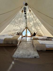 Postel nebo postele na pokoji v ubytování Berchez Glamping + 39 fotografií