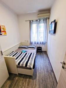 Ένα ή περισσότερα κρεβάτια σε δωμάτιο στο Croparadise Hostel