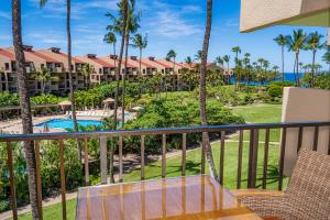a balcony with a view of the resort at Kamaole Sands 3-303 in Wailea