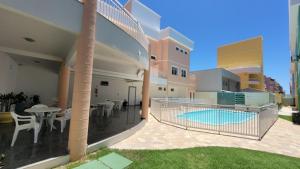 a balcony of a house with a swimming pool at B720 - Apartamento 2 quartos em cond. com piscina in Bombas