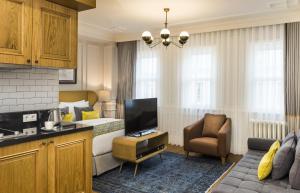 a hotel room with a bed and a television at Nevv Bosphorus Hotel in Istanbul