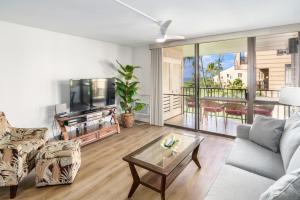 a living room with a couch and a table at Kamaole Sands 5-316 in Wailea