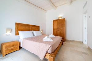 Postel nebo postele na pokoji v ubytování Naturelais Masseria Pittore Monopoli + 18 fotografií
