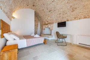TV a/nebo společenská místnost v ubytování Naturelais Masseria Pittore Monopoli