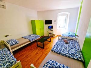 Ένα ή περισσότερα κρεβάτια σε δωμάτιο στο Croparadise Hostel