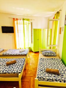 Ένα ή περισσότερα κρεβάτια σε δωμάτιο στο Croparadise Hostel
