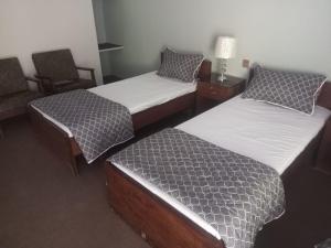 Кровать или кровати в номере Palms View