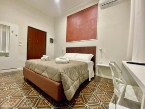 Postel nebo postele na pokoji v ubytování B&B Hèlios