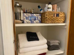 a towel rack with towels in a bathroom at Peace of Cleveland 2bdrm Plus Semi Private Study with Futon 1st Floor Apartment Pets Welcomed, Family Friendly in Cleveland