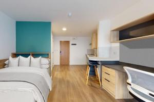 a hotel room with a bed and a desk at Private Bedrooms with Shared Kitchen, Studios and Apartments at Canvas Arundel House in the heart of Coventry in Coventry